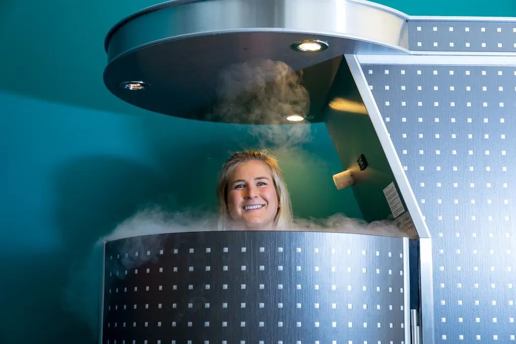 Cryotherapy for Diabetes: Can It Help Control Blood Sugar? a woman is smiling while standing in a steaming pot with steam coming out of the top of the pot